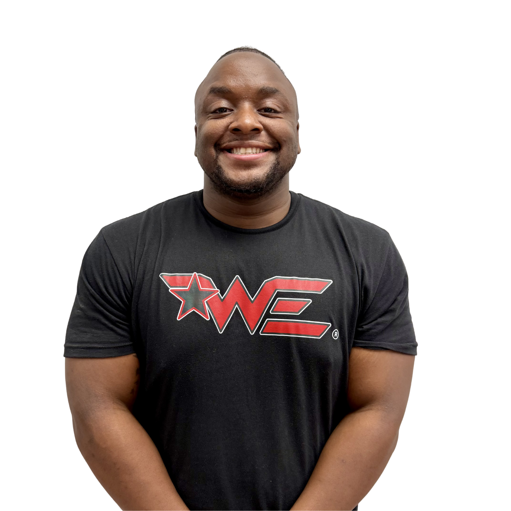 Smiling man wearing a black t‑shirt with a large red star and bold red lettering logo on the front.