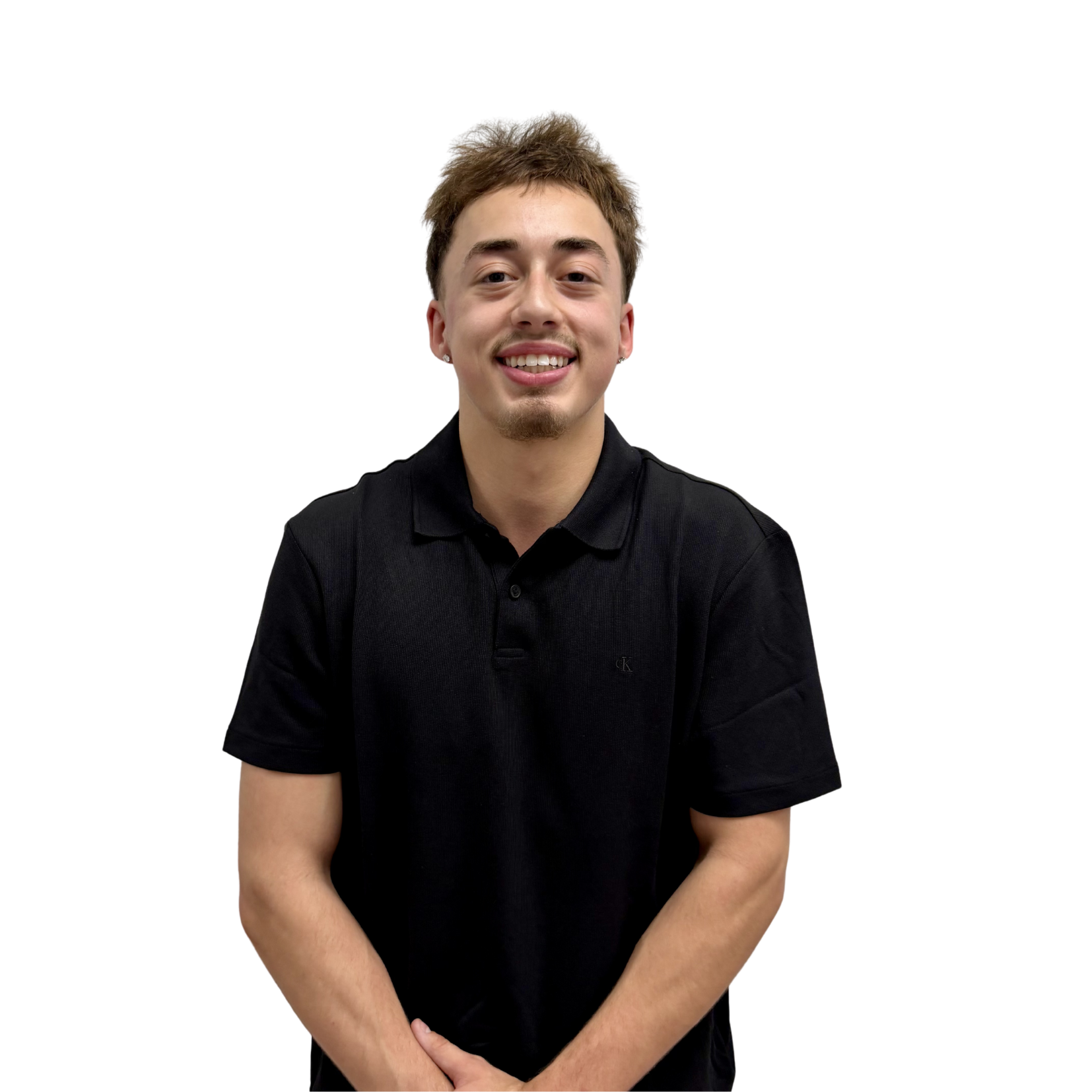 Smiling young man with short brown hair in a black polo shirt against a white background.