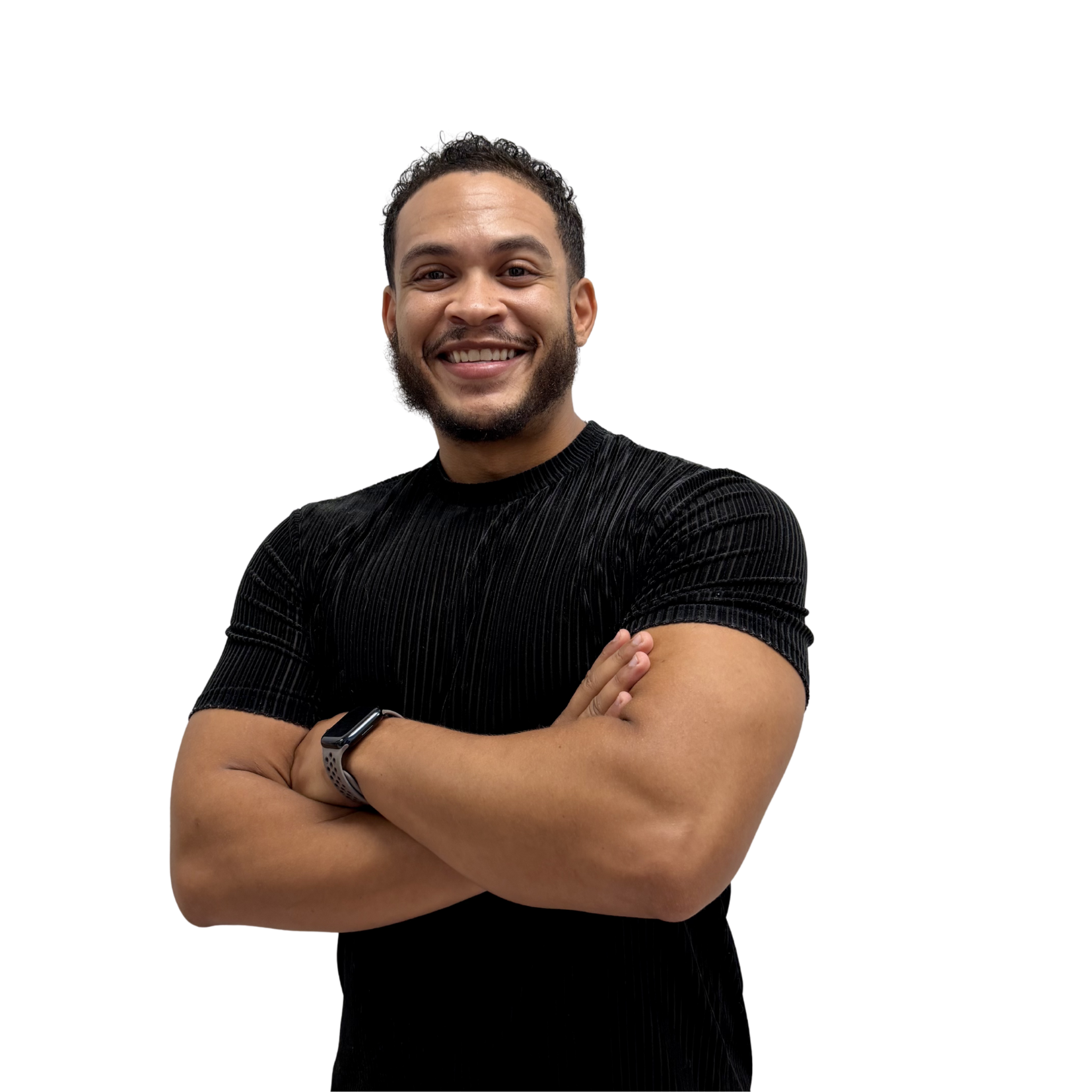 Smiling man with short curly hair and a beard, arms crossed, wearing a black striped shirt against a white background.